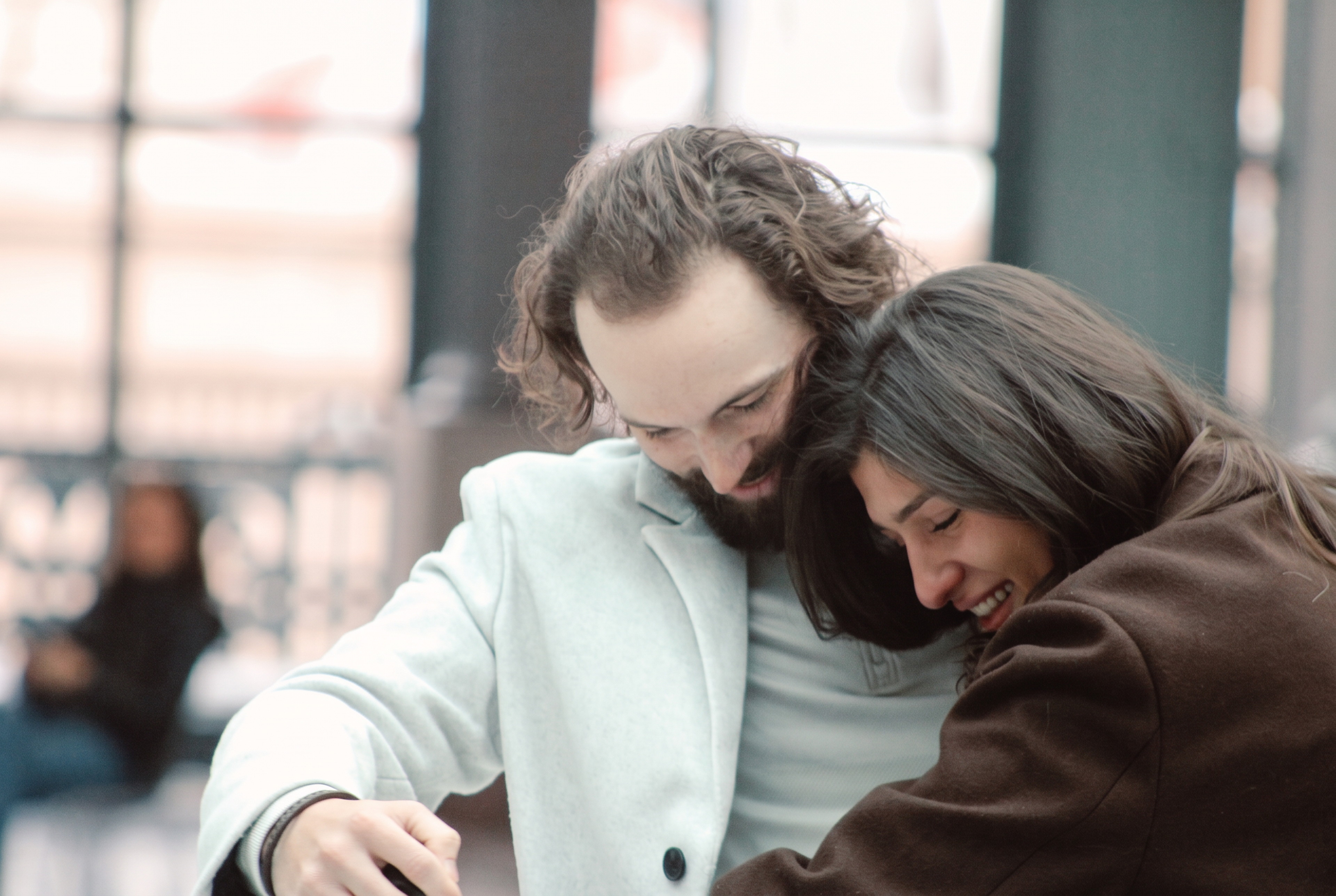 Nick and Mariella smiling and leaning into each other