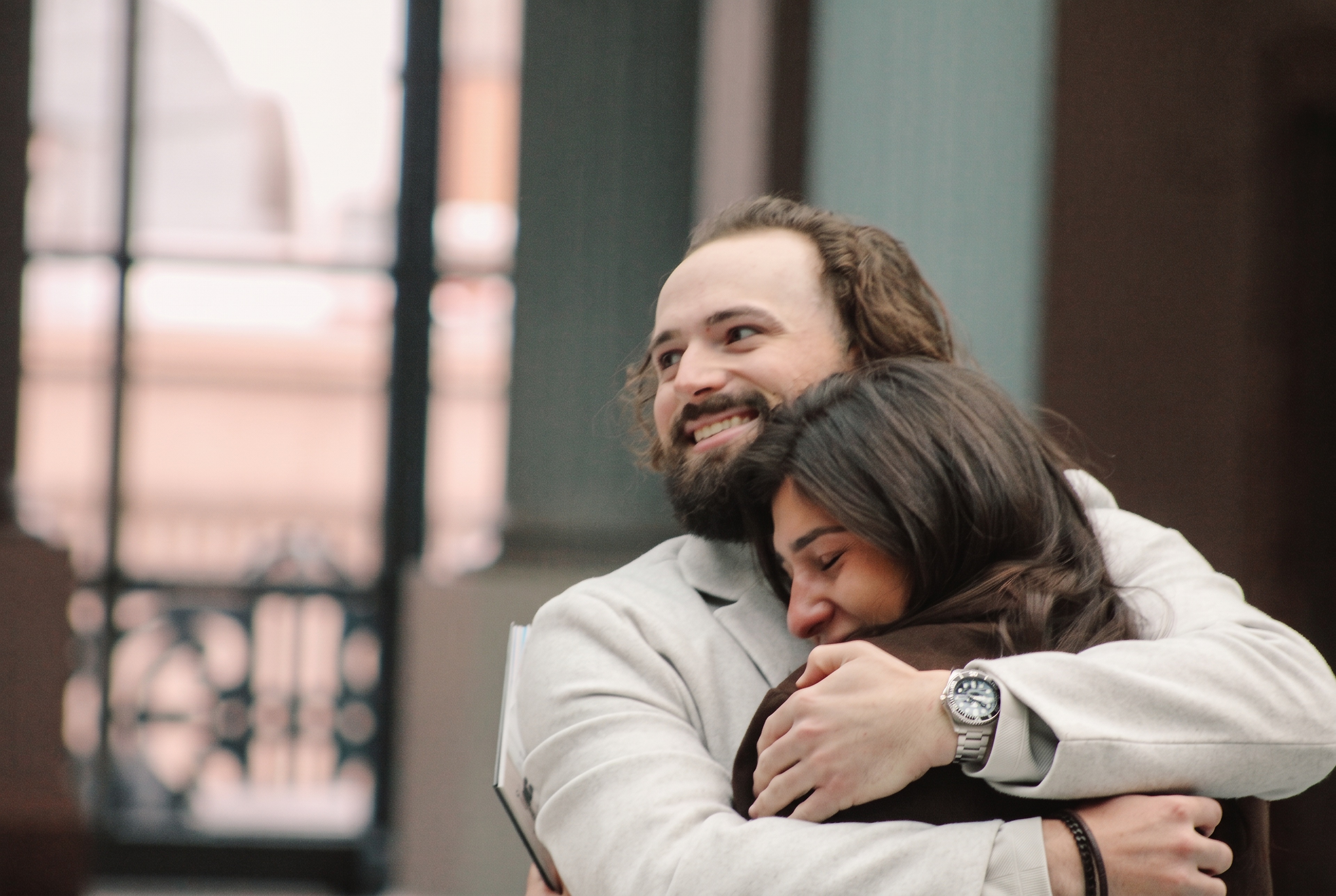 Mariella smiling in Nick's arms after their engagement