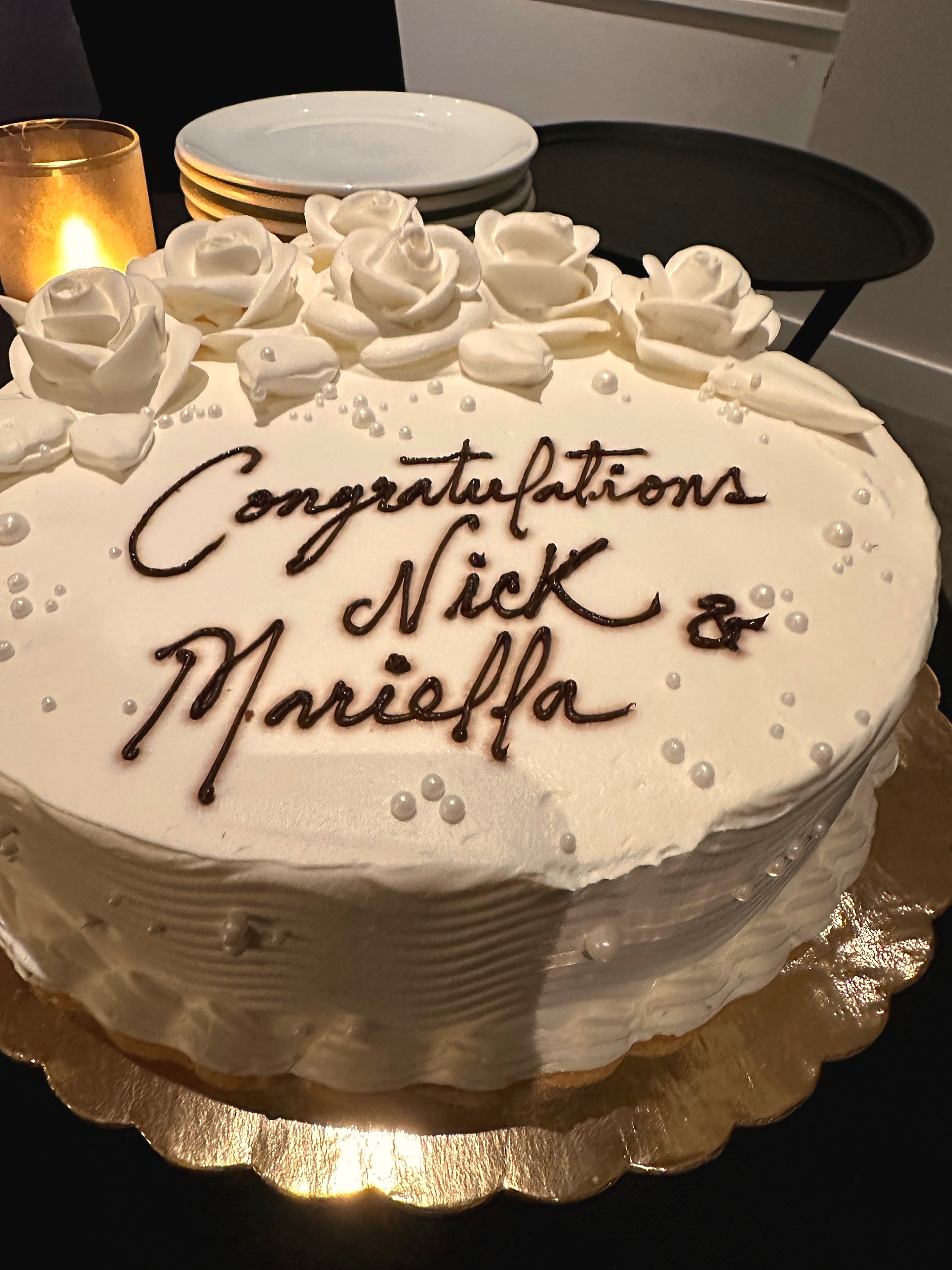 Celebration cake reading Congratulations Nick and Mariella